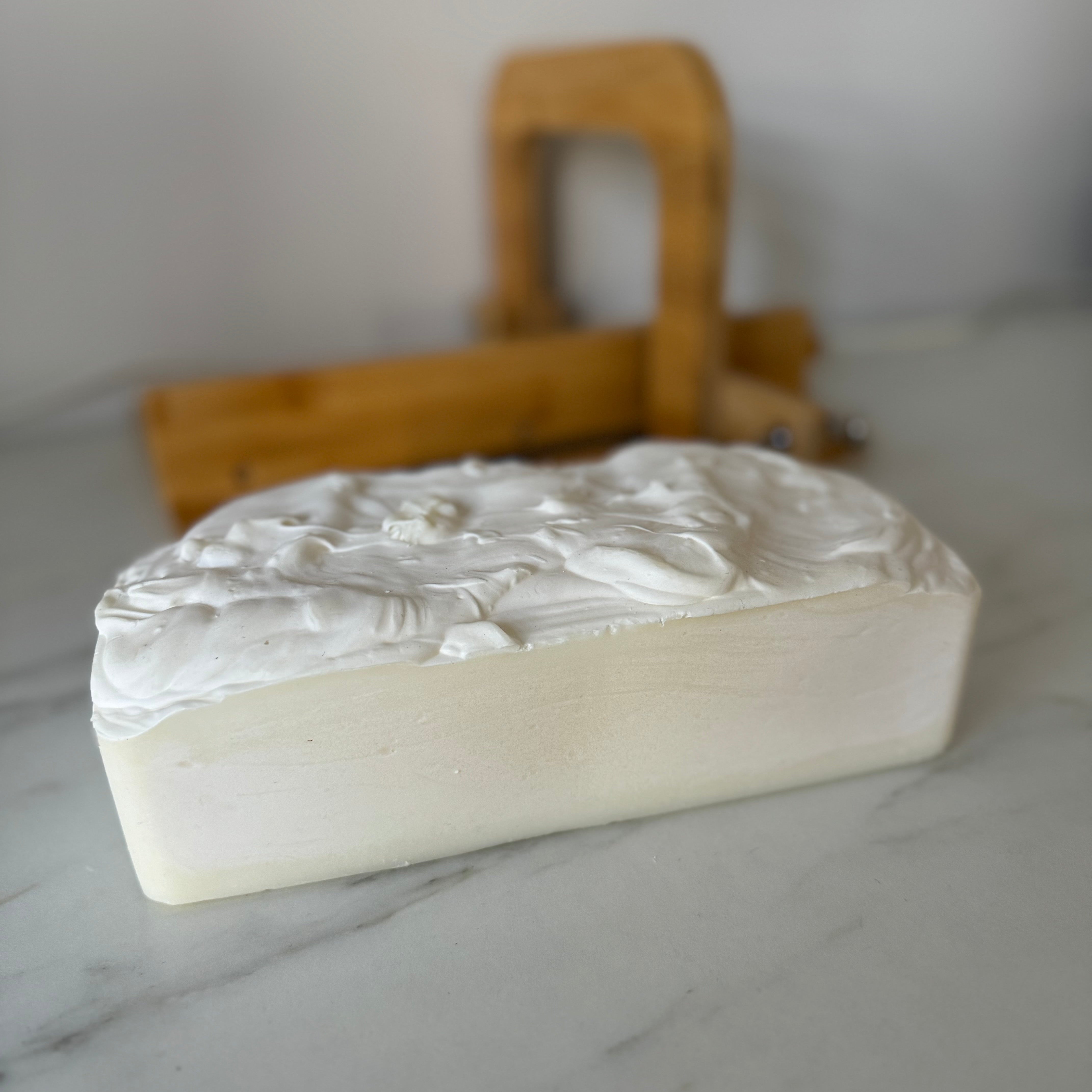 Bar of soap with a textured surface on a marble surface
